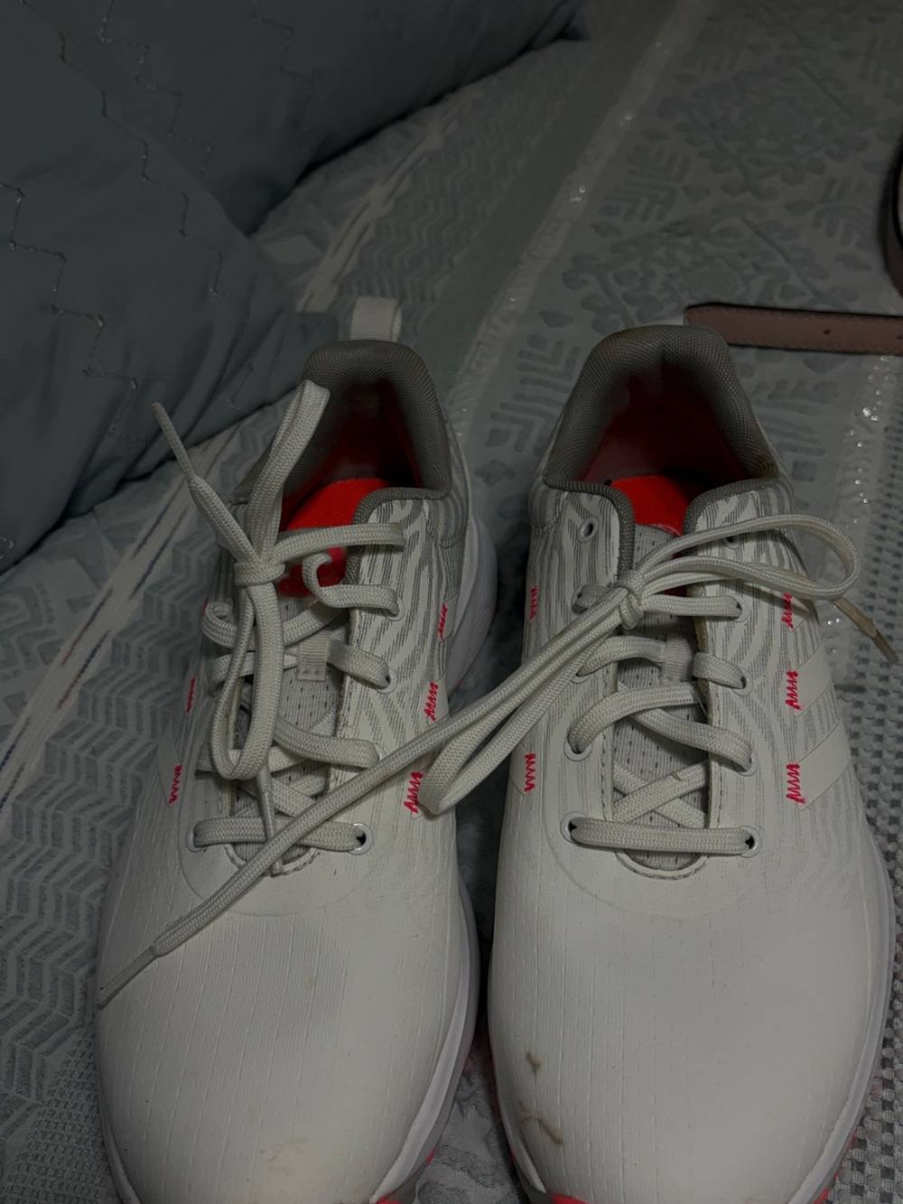 Woman’sWhite Athletic golf shoes with orange Accents size 8